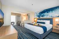 Best Western Plus Ensemble de chambre à coucher moderne pour hôtel Meubles de chambre en métal Queen and King Meubles à panneaux en bois pour l'hospitalité commerciale