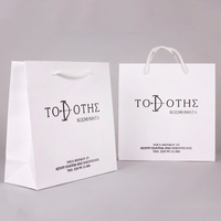 Logo imprimé personnalisé quantité minimale de commande, emballage de luxe pour cosmétiques et soins de la peau, sac cadeau d'achat en papier blanc