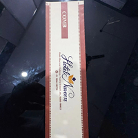 Pochette de luxe écologique à deux poignées, en papier chromo, imprimée quadricolore, avec marquage à chaud et thermoscellage central