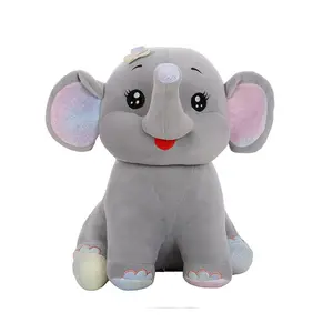 Seduto happy little elephant action figure con grandi orecchie regali tronco lungo simpatici giocattoli di peluche elefante bowknot logo personalizzato