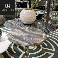 Table basse centrale de luxe moderne avec dessus en marbre noir Base en acier inoxydable doré et pierre naturelle pour meubles de maison