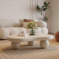 Table Basse Nuage Nordique Minimaliste et Luxueuse Crème Blanc Unique et Élégante avec Piétement Sphérique Noir