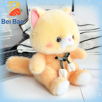 Peluche de chat de haute qualité avec nœud floral, en stock pour fabricants de peluches pour machines à griffes
