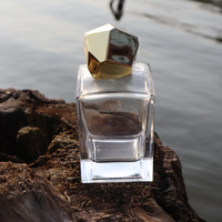 Flacon diffuseur de parfum rectangulaire en verre transparent avec pulvérisateur à pompe doré