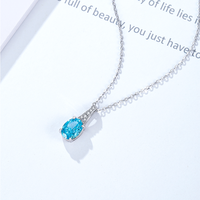 Collier élégant Damila Jewelry, bleu clair ovale, coupe Ice Flower, zircone cubique blanche, plaqué platine, argent 925, pendentif