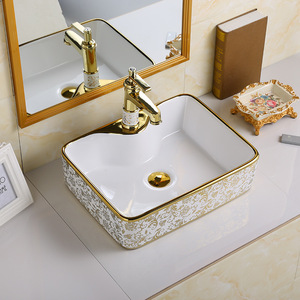 Vente directe <span class=keywords><strong>d</strong></span>'usine, vente en gros de sanitaires en céramique de luxe, lavabo ovale en céramique dorée pour salle de bain - Product Image 1