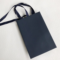 Nouveau sac à main haut de gamme bleu foncé à carreaux, sac de rangement en papier avec ruban de mode et bijoux, vente directe d'usine