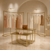Comptoir de présentation en métal doré avec base en X pour magasin de vêtements, fourniture d'usine OEM ODM