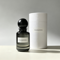 Flacon de parfum cylindrique de luxe vide en verre ambré ou noir personnalisé de 30 ml, 50 ml, 100 ml avec capuchon noir sérigraphié