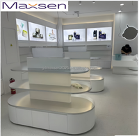 Table d'îlot de présentation en L blanche personnalisée avec éclairage LED, présentoir de magasin moderne à niveaux, décoration intérieure Maxsen, écologique et durable