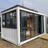 Maison conteneur préfabriquée modulaire en acier de 20 pieds avec mur rideau en verre pour bureau, studio, jardin, extérieur