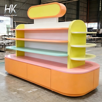Comptoir d'exposition Hongkai personnalisable avec éclairage LED, écologique, base rose pastel, plateau lavande, et piédestal à niveaux vert menthe pour