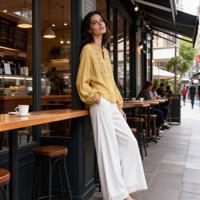 Chemisier brodé à col en V pour femme, coupe ample décontractée, manches longues et poignets bouffants, idéal printemps-été