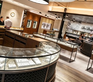 Design d'intérieur de bijouterie de luxe en crème et or, solution de vente au détail clé en main avec comptoir d'exposition en forme d'anneau - Product Image 2
