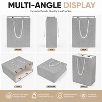 Sac en papier gaufré de luxe prêt à commander avec poignée en corde, service de logo personnalisé, fond durable pour emballage cadeau de magasin de vêtements