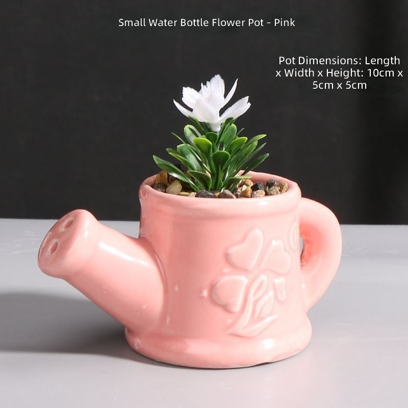 Piccolo annaffiatoio per vaso di fiori rosa