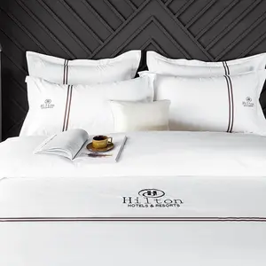 Set di biancheria da letto su misura per Hotel collezione di Hotel Set di lenzuola per Hotel con Logo personalizzato con piumino trapuntato per dormire nudo dell'hotel