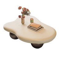 Table basse élégante et luxueuse de style nordique minimaliste, mini, unique, couleur crème, avec base en boule noire