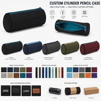 Étui à crayons cylindrique noir en toile avec fermeture éclair bleue et doublure turquoise pour l'école et le bureau