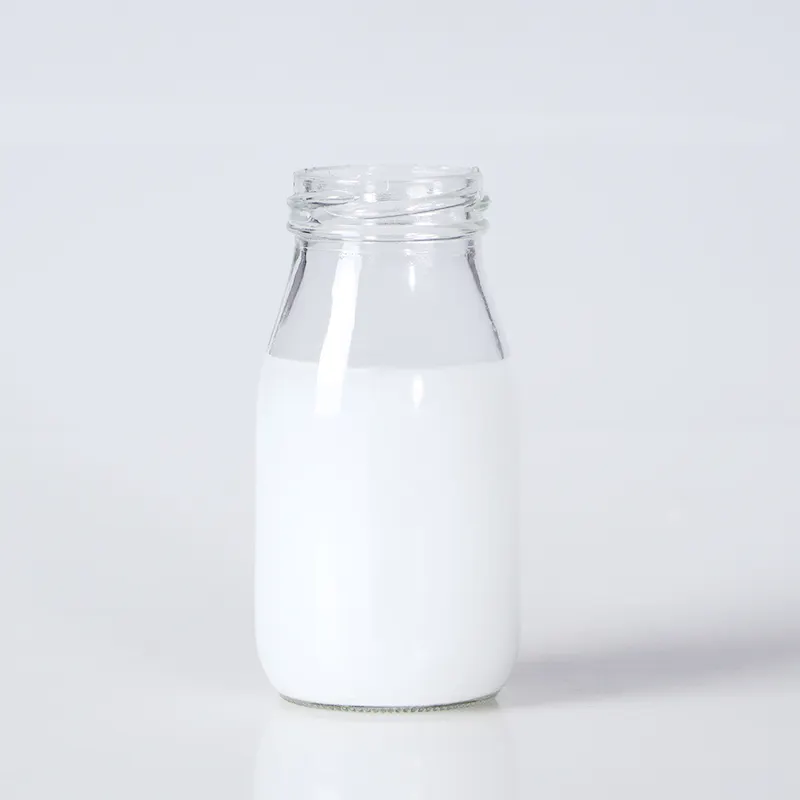Botella de pudín de leche de vidrio transparente de uso alimentario vacía a precio barato de 200ml con tapa de hojalata