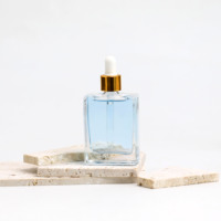 Vente chaude Carré Transparent Cheveux Noirs Huile En Verre Flacon compte-gouttes Rectangle Pour Huile Essentielle Parfum 30Ml 50Ml 100Ml