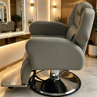 Fauteuil de barbier de luxe personnalisé en cuir gris avec pompe hydraulique inclinable synthétique pour salon de coiffure