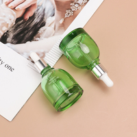 Flacon compte-gouttes rond en verre vert Bravo Industrial avec bouchon pipette en caoutchouc et aluminium argenté pour huiles essentielles et sérum facial