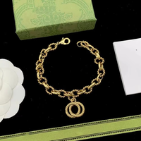 Vente en gros de bijoux de marque célèbre, collier, bracelet et boucles d'oreilles avec breloque lettre GG plaqué or