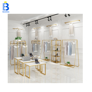 Estante de ropa de Boutique De Oro Ecológico portátil moderno Estantes de exhibición de diseño interior de tienda minorista bonita - Product Image 3