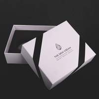 Boîtes d'emballage élégantes personnalisées d'ensemble de soins de la peau en papier carton noir et blanc pour l'emballage de produits de soin