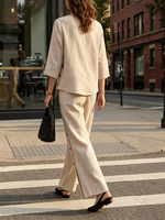 Ensemble décontracté femme 2026 : chemise en lin mélangé et pantalon large, tenue deux pièces boutonnée à ourlet irrégulier pour printemps-été