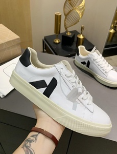 Dropshipping : Baskets originales en cuir véritable blanc avec logo noir, à lacets, bout rond, respirantes, baskets décontractées de créateur - Product Image 1