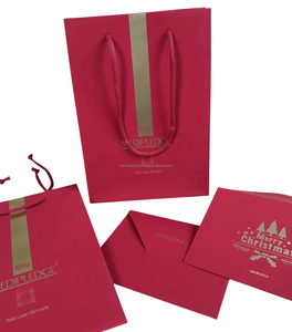 ถุงช้อปปิ้งสีแดงฟอยล์สีทองพิมพ์ลายกำหนดเองถุงกระดาษบรรจุภัณฑ์พร้อมริบบิ้น - Product Image 1