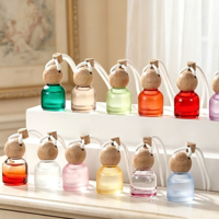 Vente en gros de flacons de parfum cylindriques pour voiture de 10 ml, flacons de parfum suspendus multicolores pour voiture, logo personnalisé