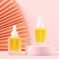 Flacon compte-gouttes en verre de 30 ml, carré arrondi, sérigraphié, pour cosmétiques, soins de la peau, huiles essentielles, essence de rose dorée, vente en gros