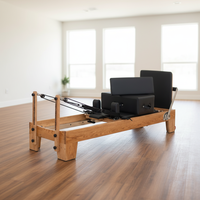 CE Hochwertiger Langlebiger Holz-Pilates-Reformer für Heimfitness-Studio Kernkörper-Fitnessbett in Roteichen-Farbe+Logo-Anpassung