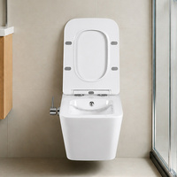 WC suspendu de style moderne avec douchette bidet intégrée, en céramique sans rebord, pour salle de bain d'hôtel