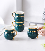 Service à thé de luxe de style nordique, moderne, en céramique dorée peinte à la main, nouveau service créatif de tasses et de carafes à café