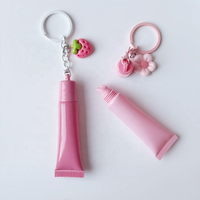 Tubes de gloss à lèvres en plastique personnalisés en gros, tubes d'essence pour les lèvres avec trou, pour les soins de la peau et des lèvres, avec pendentif en chaîne à billes