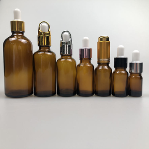 Botella de Vidrio Ámbar Redonda de 30 ml para Aceites Esenciales y Sueros, con Gotero, Impresión Serigráfica, Recargable - Product Image 1