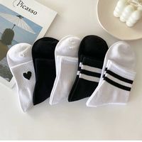 Version coréenne des chaussettes en coton unisexes de style uniforme scolaire mi-mollet