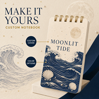 Carnet spirale LABON personnalisé « Mélange de Lune » avec couverture crème, reliure double spirale dorée, motifs vagues, lune pleine, perles et coquillages festonnés