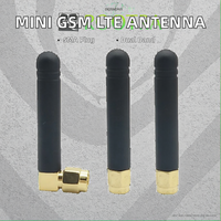 Mini Antena de goma de 50MM con ángulo recto SMA omnidireccional en blanco y negro para GSM 3G 4G LTE Vertical