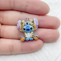 Dibujos animados azul brillante Alien Fangtooth Diy accesorios de resina caja de teléfono basura encantos cadena colgante decoraciones suministros