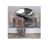 Les conceptions d'intérieur fantaisie d'escaliers en spirale de balustrade en verre avec du verre trempé de 12mm sont conformes au code du bâtiment d'Amerian