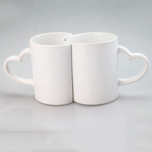 11 OZ Commercio All'ingrosso Paio <span class=keywords><strong>a</strong></span> <span class=keywords><strong>forma</strong></span> <span class=keywords><strong>di</strong></span> <span class=keywords><strong>Cuore</strong></span> <span class=keywords><strong>Tazza</strong></span> <span class=keywords><strong>di</strong></span> Sublimazione Manico <span class=keywords><strong>a</strong></span> <span class=keywords><strong>forma</strong></span> <span class=keywords><strong>di</strong></span> <span class=keywords><strong>Cuore</strong></span> <span class=keywords><strong>Tazza</strong></span> Bianca - Product Image 2