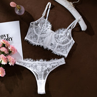 Ensemble de lingerie 2 pièces transparent de luxe en dentelle brodée pour femme, avec string et body sexy, vente en gros