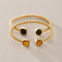 Bracelet manchette torsadé J&D Designer Vintage en acier inoxydable plaqué or 18 carats PVD avec ambre en résine naturelle