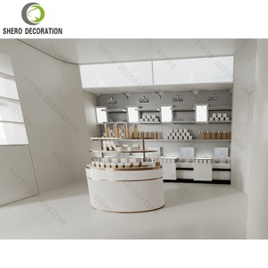 Table de présentation de parfums sur mesure, décoration de magasin de maquillage, mobilier de magasin de cosmétiques, présentoir en bois personnalisé pour les soins de la peau - Product Image 1