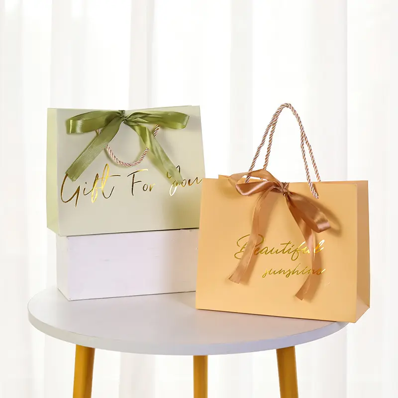 Wholesale luxury custom shopping paper bag boutique paper shopping bag with ribbon handle